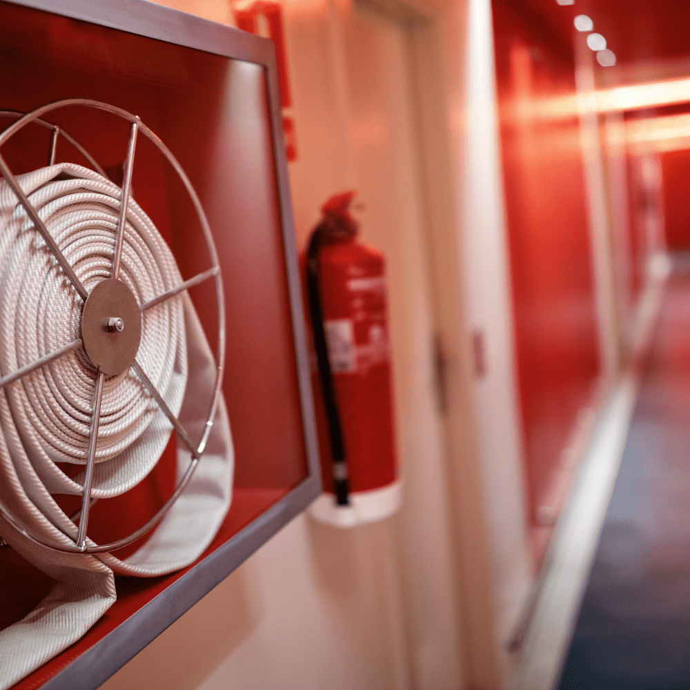 fire-extinguisher-and-hose-reel-in-hotel-corridor-2021-08-26-22-29-58-utc 1-min